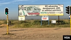 A billboard in Harare on March 07, 2024, shows President Emmerson Mnangagwa's defiance against U.S. sanctions. (Columbus Mavhunga/VOA)
