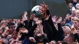 Players fight for the ball during the annual Shrovetide football match in Ashbourne, Britain, Feb. 21, 2023.
