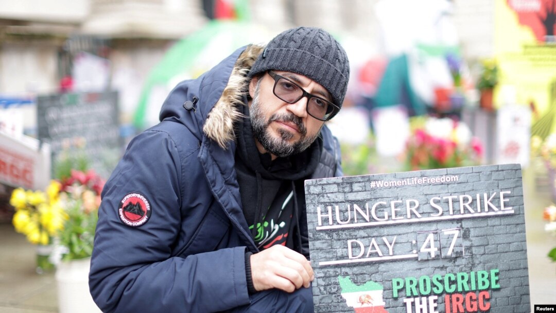FILE - British-Iranian activist Vahid Beheshti sits in London, April 10, 2023. Behishti been on a hunger strike for 66 days, calling on the U.K. to recognize the IRGC as a terrorist group. Thousands of Iranians rallied in London on Saturday to make the same case.