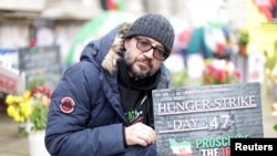 FILE - British-Iranian activist Vahid Beheshti sits in London, April 10, 2023. Behishti been on a hunger strike for 66 days, calling on the U.K. to recognize the IRGC as a terrorist group. Thousands of Iranians rallied in London on Saturday to make the same case.