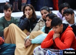 Indian wrestlers take part in a protest demanding the disbandment of the WFI and the investigation of its head by the police, who they accuse of sexually harassing female players, at Jantar Mantar in New Delhi, Jan. 19, 2023.