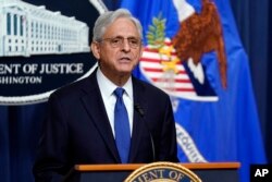 FILE - Attorney General Merrick Garland speaks at the Department of Justice, Aug. 11, 2023, in Washington.