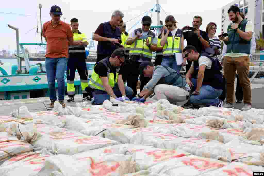 Spanish police officers carry out a test on drugs found on an intercepted Brazilian fishing vessel carrying around 1,500 kilograms of cocaine in Gran Canaria, Spain.