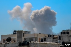 Dim se diže nakon izraelskog bombardiranja u blizini bolnice Shifa u gradu Gaza, 23. marta 2024.
