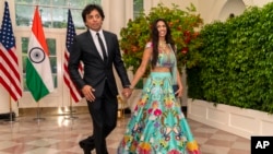 Filmmaker M. Night Shyamalan and his wife, Bhavna Shyalaman, arrive for the state dinner with President Joe Biden and India's Prime Minister Narendra Modi at the White House, June 22, 2023, in Washington.