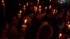 Family members and supporters of trafficking victims forced to perpetrate online scams hold a candlelight vigil in Kuala Lumpur, Malaysia, in October 2022. (David Grunebaum/VOA)