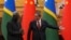 FILE - Chinese Premier Li Qiang, right, shows the way to his Solomon Islands counterpart Manasseh Sogavare after they witnessed signing on agreement for both countries at the Great Hall of the People in Beijing, July 10, 2023.