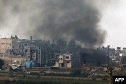 A picture taken from southern Israel bordering the Gaza Strip on Dec. 27, 2023, shows smoke after an Israeli bombardment in the Palestinian territory amid ongoing battles with the Hamas militant group.