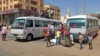 People board a bus as they evacuate southern Khartoum, Sudan, on May 23, 2023, after a one-week cease-fire between Sudan's army and paramilitary Rapid Support Forces officially started.