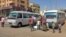People board a bus as they evacuate southern Khartoum, Sudan, on May 23, 2023, after a one-week cease-fire between Sudan's army and paramilitary Rapid Support Forces officially started.