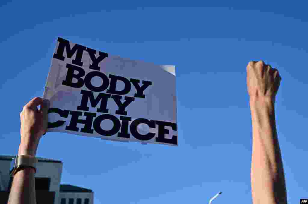 Pro-abortion rights demonstrators rally in Scottsdale, Arizona, after the state's top court ruled a 160-year-old near total ban on abortion is enforceable.
