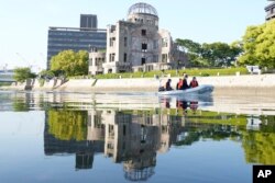 Police officers patrol on the river near the famed Atomic Bomb Dome as Japan's police beef up security ahead of the Group of Seven nations' meetings in Hiroshima, western Japan, May 17, 2023.
