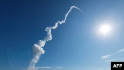 A trail of smoke follows an HII-A rocket after it launched from the Tanegashima Space Center on Tanegashima island, Japan, on Sept. 7. 2023. (JAXA via AFP)