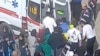 این تصویر ثابت از ویدئویی بدون تاریخ در ۱ مارس ۲۰۲۳ منتشر شده و به دست رویترز رسیده است و صحنه‌ای پس از گزارش مسمومیت در اردبیل را نشان می‌دهد که یک نفر در بیرون از یک مدرسه دخترانه، به آمبولانس منتقل می‌شود.