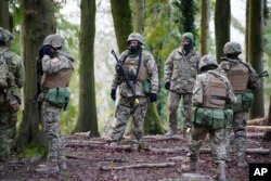 FILE - Ukrainian soldiers during training on Salisbury Plain in Wiltshire, Britain, where Australian Armed Forces are supporting the UK-led training of Ukrainian recruits, Feb. 1, 2023. (Ben Birchall/Pool via AP)