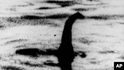 FILE - An undated photo shows a shadowy shape that some say is the Loch Ness monster in Scotland, later debunked as a hoax.