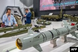 Guided missiles are displayed at the Russian pavilion during the International Defense Exhibition (IDEX) at the Abu Dhabi International Exhibition Centre, Feb. 20, 2023.