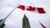 FILE - A Canadian flag flies in front of the peace tower on Parliament Hill in Ottawa, Canada, on Dec. 4, 2015.