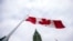 FILE - A Canadian flag flies in front of the peace tower on Parliament Hill in Ottawa, Canada on Dec. 4, 2015.