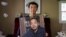 Sophie Luo Shengchun, istri pengacara HAM China yang ditahan Ding Jiaxi, berfoto bersama foto suaminya di rumahnya di Alfred, New York, 28 Juli 2022. (Foto: Brendan McDermid/Reuters)
