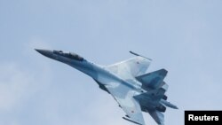 FILE - A Russian Sukhoi Su-35S jet fighter performs a flight during the Aviadarts competition, as part of the International Army Games 2021, at the Dubrovichi range outside Ryazan, Russia, August 27, 2021.
