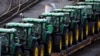 FILE - A line of John Deere tractors sit in Norfolk Southern's Conway Yard in Conway, Pennsylvania, Dec. 5, 2022. U.S. manufacturing activity edged lower in June 2024.