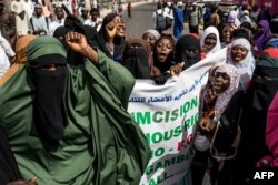 FILE — Pro- Female Genital Mutilation (FGM) protesters gather outside the National Assembly in Banjul, Gambia, on March 18, 2024.