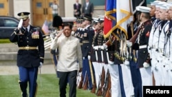 Philippine President Ferdinand Marcos Jr. reviews a military honor guard during a full honors arrival ceremony at the Pentagon in Washington, U.S., May 3, 2023. REUTERS/Kevin Lamarque 