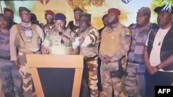 This video grab taken from Gabon 24 shows Gabonese soldiers appearing on television on Aug. 30, 2023, announcing they were "putting an end to the current regime" of President Ali Bongo Ondimba.