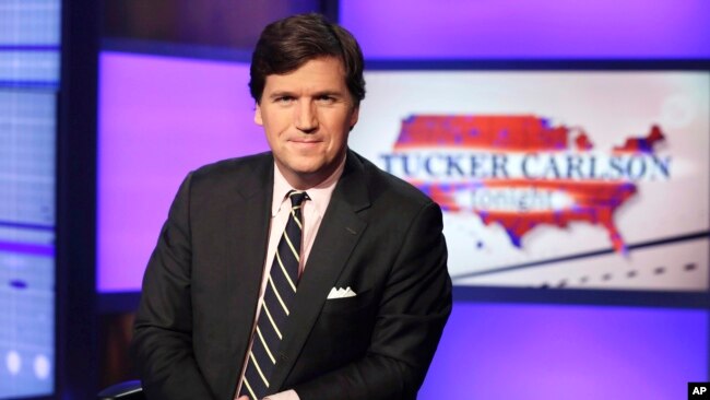 FILE - Tucker Carlson poses in a Fox News Channel studio in New York, March 2, 2017. Fox took Carlson off the air last month; on Tuesday he said he would relaunch his show on Twitter