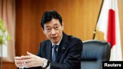 FILE - Nishimura Yasutoshi, Minister of Economy, Trade and Industry (METI), talks during an interview with Reuters in Tokyo, Japan, April 5, 2023. 