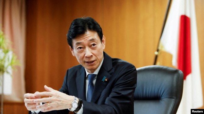 FILE - Nishimura Yasutoshi, Minister of Economy, Trade and Industry (METI), talks during an interview with Reuters in Tokyo, Japan, April 5, 2023.