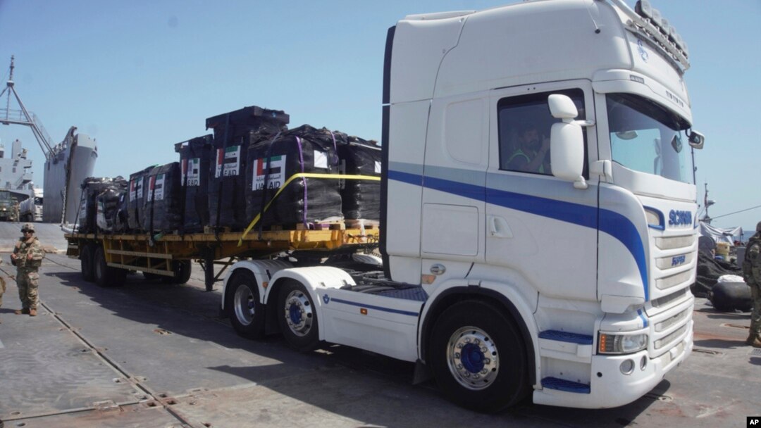 In this photo provided by US Central Command, humanitarian aid arrives in Gaza, June 8, 2024.