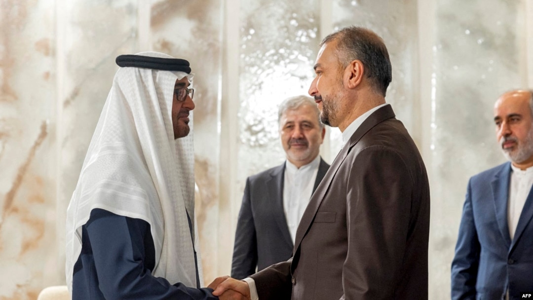 This handout image provided by the UAE's Presidential Court shows UAE's President Sheikh Mohamed bin Zayed al-Nahyan, left, meeting with Iran's Foreign Minister Hossein Amir-Abdollahian in Abu Dhabi on June 22, 2023. 