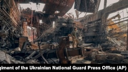 FILE - Photo by Azov Special Forces Regiment of the Ukrainian National Guard Press Office, Ukrainian soldier in the Azovstal steel plant in Mariupol, Ukraine, May 16, 2022.