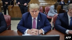 FILE - Former U.S. President Donald Trump attends his trial for allegedly covering up hush money payments, at Manhattan Criminal Court in New York City, April 19, 2024. 