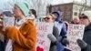 FILE - Advocates for transgender youth rally outside the New Hampshire Statehouse, in Concord, N.H., March 7, 2023.