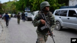 Soldiers deploy outside the Prime Minister's office in Port-au-Prince, Haiti, April 25, 2024.