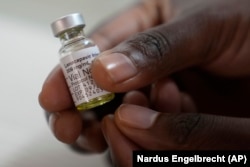 A pharmacist holds a vial of lenacapavir, at the Desmond Tutu Health Foundation's Masiphumelele Research Site, in Cape Town, South Africa, July 23, 2024. (AP Photo/Nardus Engelbrecht)