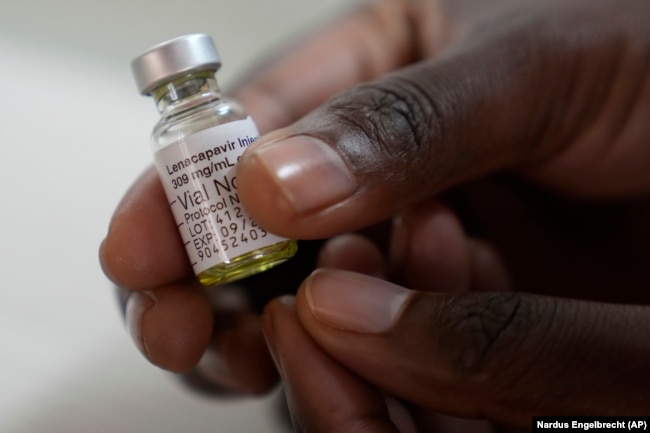 A pharmacist holds a vial of lenacapavir, at the Desmond Tutu Health Foundation's Masiphumelele Research Site, in Cape Town, South Africa, July 23, 2024. (AP Photo/Nardus Engelbrecht)