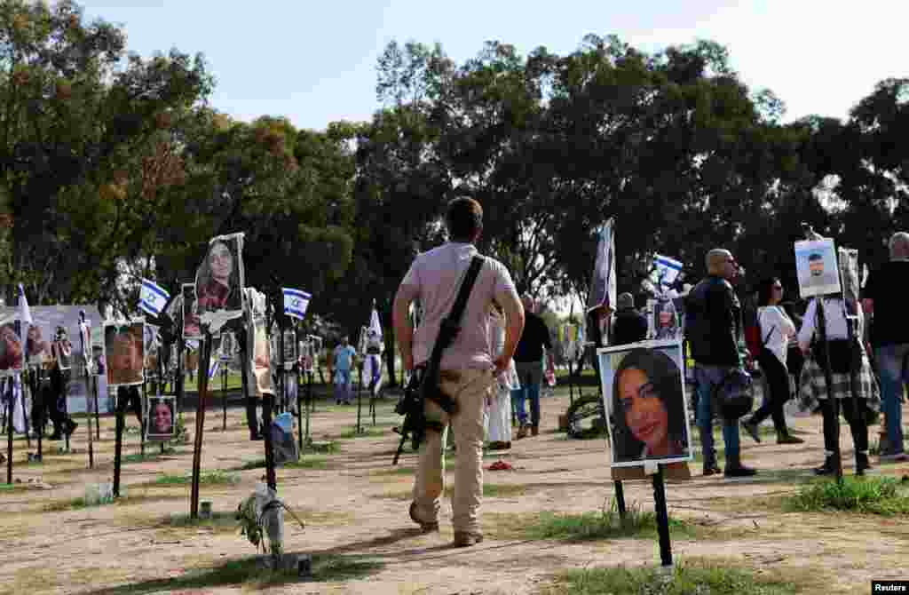 A man walks at an installation on the site of the Nova festival, where people were killed and kidnapped during the October 7 attack by Hamas gunmen from Gaza, in Reim, in southern Israel.