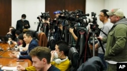 Foreign and local journalists report at a news conference at the Ministry of Foreign Affairs office in Beijing, China, April 26, 2023. 