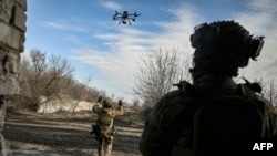 A Ukrainian serviceman flies a drone to spot Russian positions near the city of Bakhmut, in the region of Donbas, March 5, 2023. 