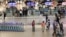 FILE - Passengers walk next to check-in counters at the O.R. Tambo International Airport in Johannesburg, South Africa, on July 3, 2023.