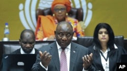 FILE - South African President Cyril Ramaphosa answers questions in parliament in Cape Town, May 11, 2023. He has appointed a judge to oversee an inquiry into allegations that the country supplied arms to Russia on a ship docked secretly at a naval base. 