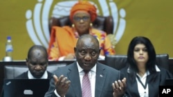 FILE - South African President Cyril Ramaphosa answers questions in parliament in Cape Town, May 11, 2023. He has appointed a judge to oversee an inquiry into allegations that the country supplied arms to Russia on a ship docked secretly at a naval base. 