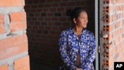 On April 2, 2024, 37-year-old Chhem Hay stood in front of the gate of the house she was building in Run Ta Ek Village, Siem Reap Province, Cambodia.