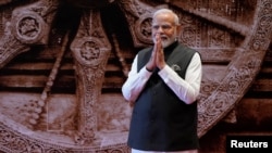 Indian Prime Minister Narendra Modi greets leaders of the G20 countries, in New Delhi, India, Sept. 9, 2023.