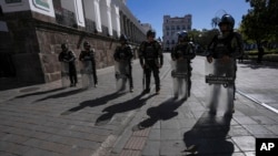 Military police guard the presidential palace in Quito, Ecuador, Aug. 10, 2023. President Guillermo Lasso declared a state of emergency after the assassination of presidential candidate Fernando Villavicencio at a campaign rally in Quito. 