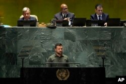 Ukraine's President Volodymyr Zelenskyy listens to applause after his address to the 78th session of the United Nations General Assembly, Sept. 19, 2023.